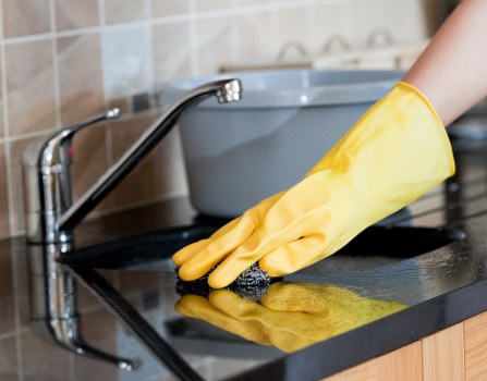 Professional cleaner maintaining a safe and organised environment